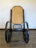 ROCKING CHAIR NOIR EN BOIS ASSISE CANNAGE. 1960 