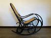 ROCKING CHAIR NOIR EN BOIS ASSISE CANNAGE. 1960 