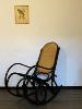 ROCKING CHAIR NOIR EN BOIS ASSISE CANNAGE. 1960 